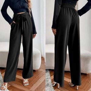 Wide leg high waisted paperbag pants belted black minimalist chic